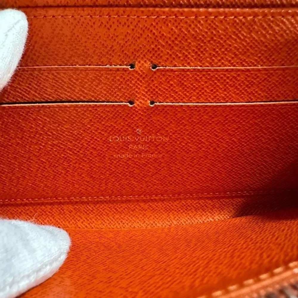 LOUIS VUITTON Long Wallet Epi Zippy Orange Women's Men's Leather